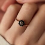 VIntage 9 carat solid gold cluster flower ring with a sapphire and diamond