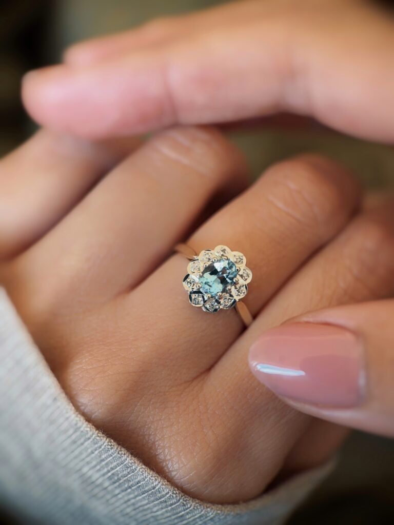 vintage topaz and diamond cluster ring in 9k gold worn on hand