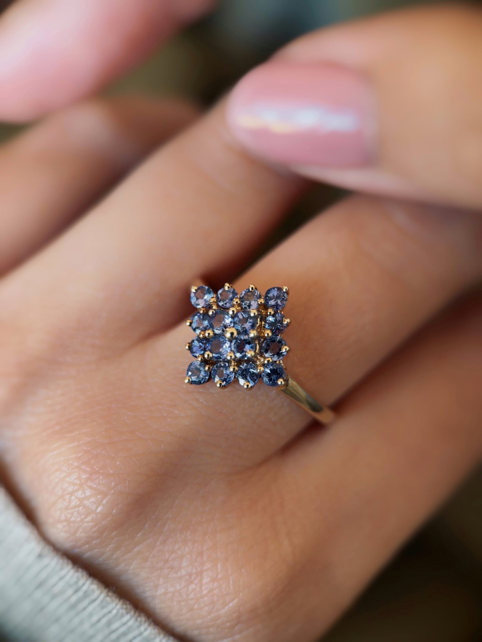 vintage tanzanite cluster ring in 9k gold worn on hand