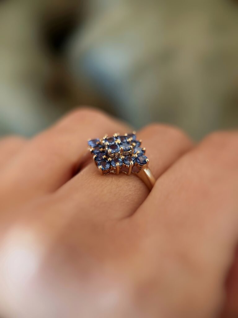 vintage tanzanite cluster ring in 9k gold worn on hand