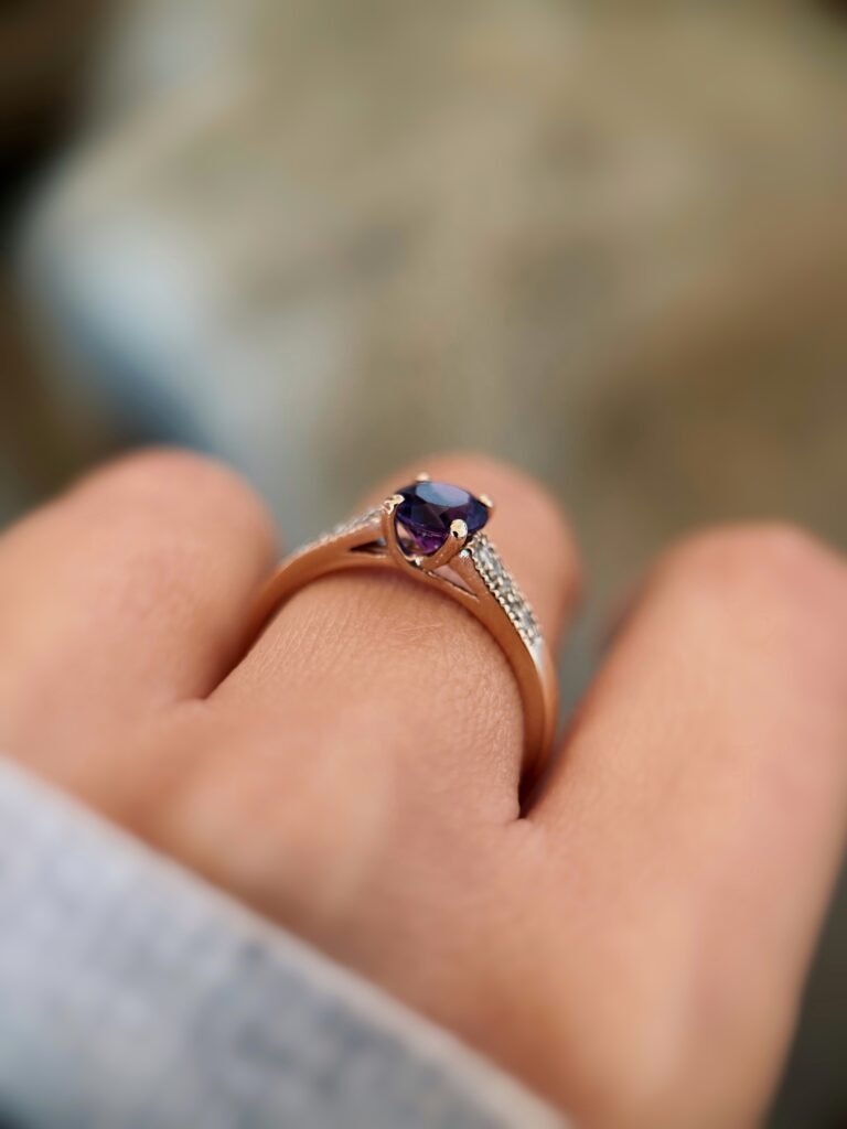 vintage amethyst and diamond solitaire ring in 9k gold worn on hand
