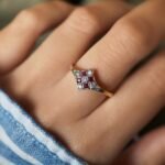 Art deco Ruby diamond cluster ring in 18k gold worn on hand