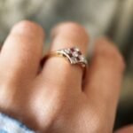 Art deco Ruby diamond cluster ring in 18k gold worn on hand