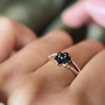 Vintage 9K gold sapphire flower cluster ring worn on a finger