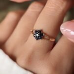 Vintage 9K gold sapphire flower cluster ring worn on a finger