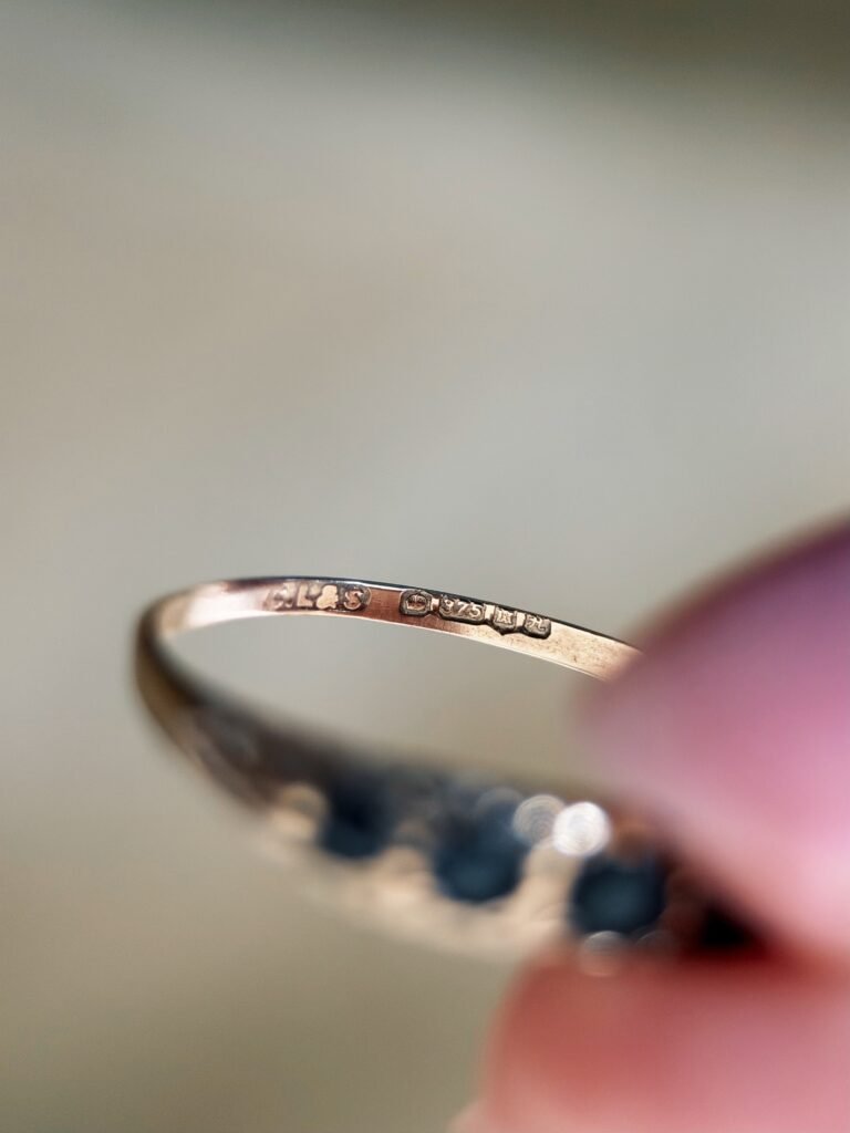 Close-up of English hallmarks inside a vintage 9 carat gold ring
