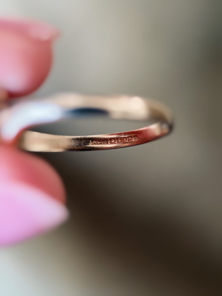 Close-up of English hallmarks inside a vintage 9 carat gold ring