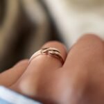 Vintage 9 carat gold swirl ring worn on a hand