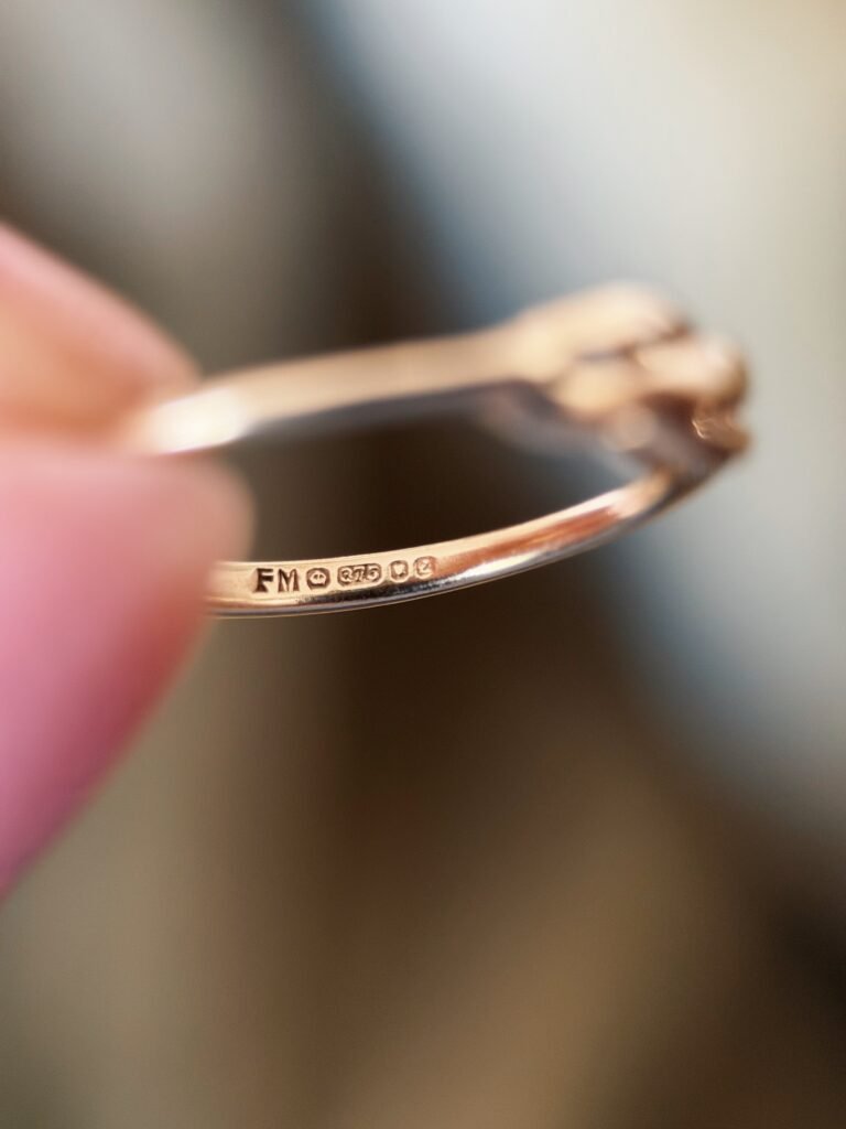 Close-up of English London hallmarks inside a vintage 9 carat gold ring