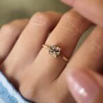 Vintage 10 carat gold quartz solitaire ring worn on a hand