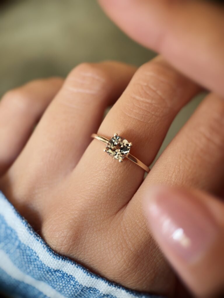 Vintage 10 carat gold quartz solitaire ring worn on a hand