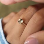 Vintage 10 carat gold quartz solitaire ring worn on a hand