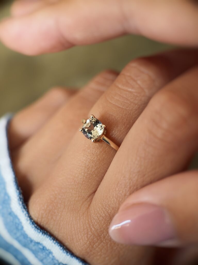 Vintage 10 carat gold quartz solitaire ring worn on a hand