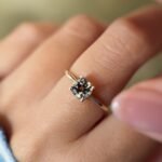 Vintage 10 carat gold quartz solitaire ring worn on a hand