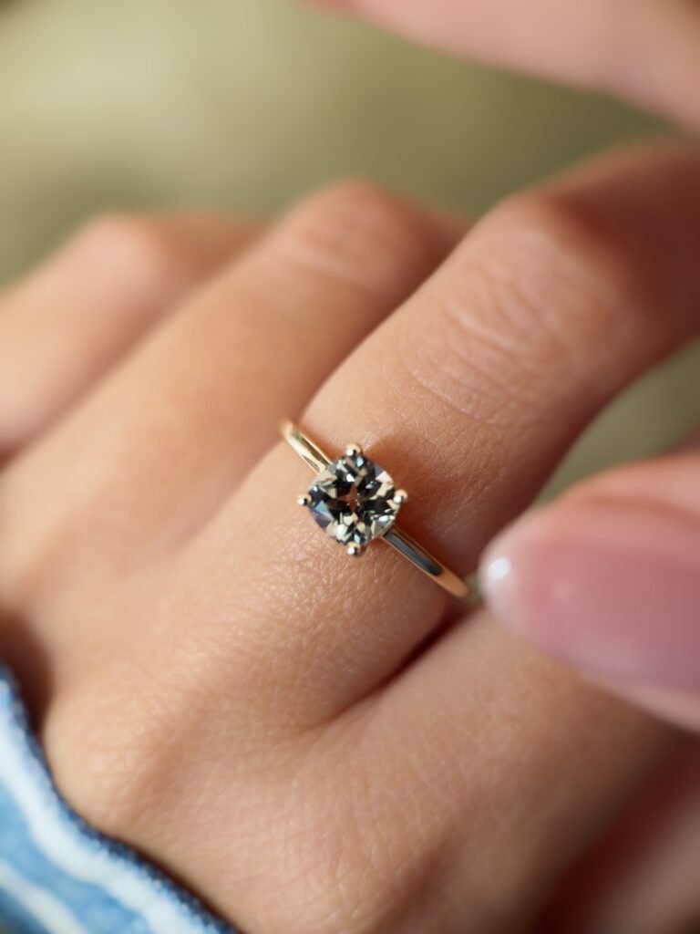 Vintage 10 carat gold quartz solitaire ring worn on a hand