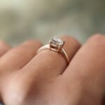 Vintage 10 carat gold quartz solitaire ring worn on a hand