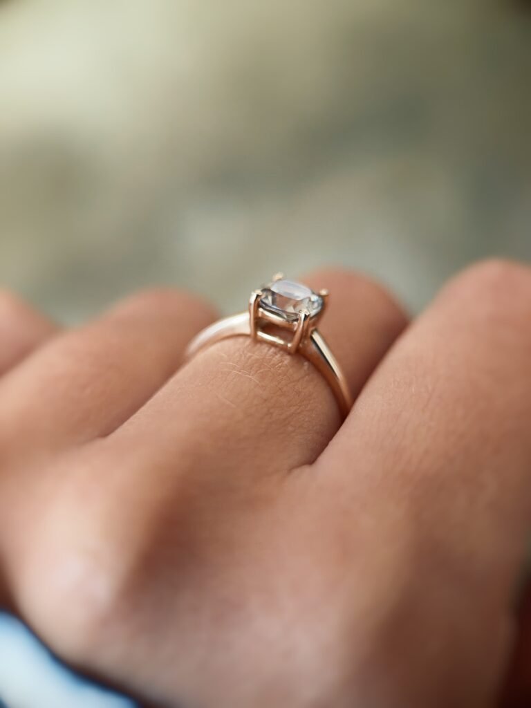 Vintage 10 carat gold quartz solitaire ring worn on a hand
