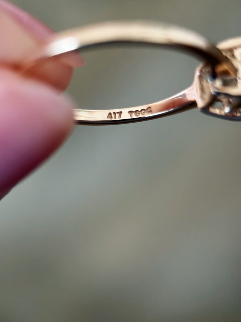 Close-up of English hallmarks inside a vintage 10 carat gold ring