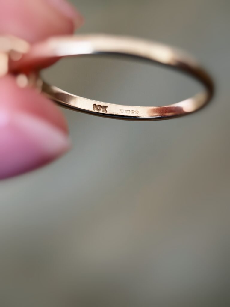 Close-up of English hallmarks inside a vintage 10 carat gold ring