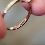Close-up of English hallmarks inside a vintage 9 carat gold ring