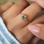 Vintage 10 carat gold quartz and diamond ring worn on a hand