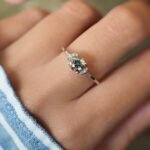 Vintage 10 carat gold quartz and diamond ring worn on a hand