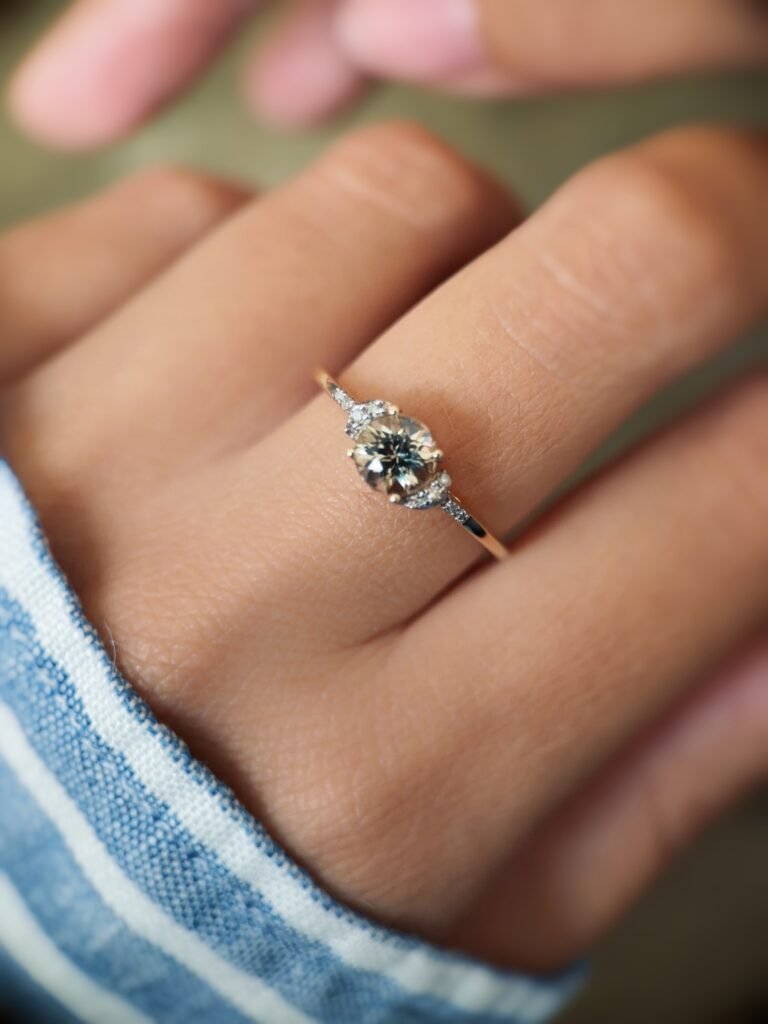 Vintage 10 carat gold quartz and diamond ring worn on a hand