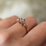 Vintage 10 carat gold quartz and diamond ring worn on a hand