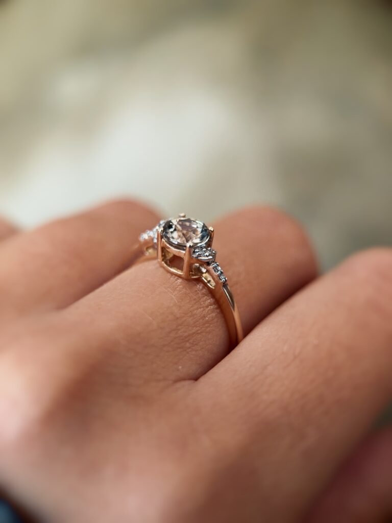 Vintage 10 carat gold quartz and diamond ring worn on a hand