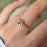 Vintage 10 carat gold quartz and diamond ring worn on a hand