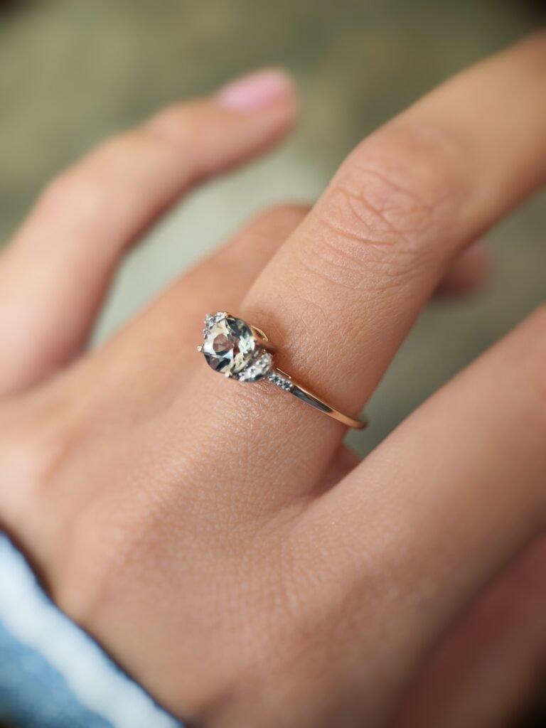 Vintage 10 carat gold quartz and diamond ring worn on a hand