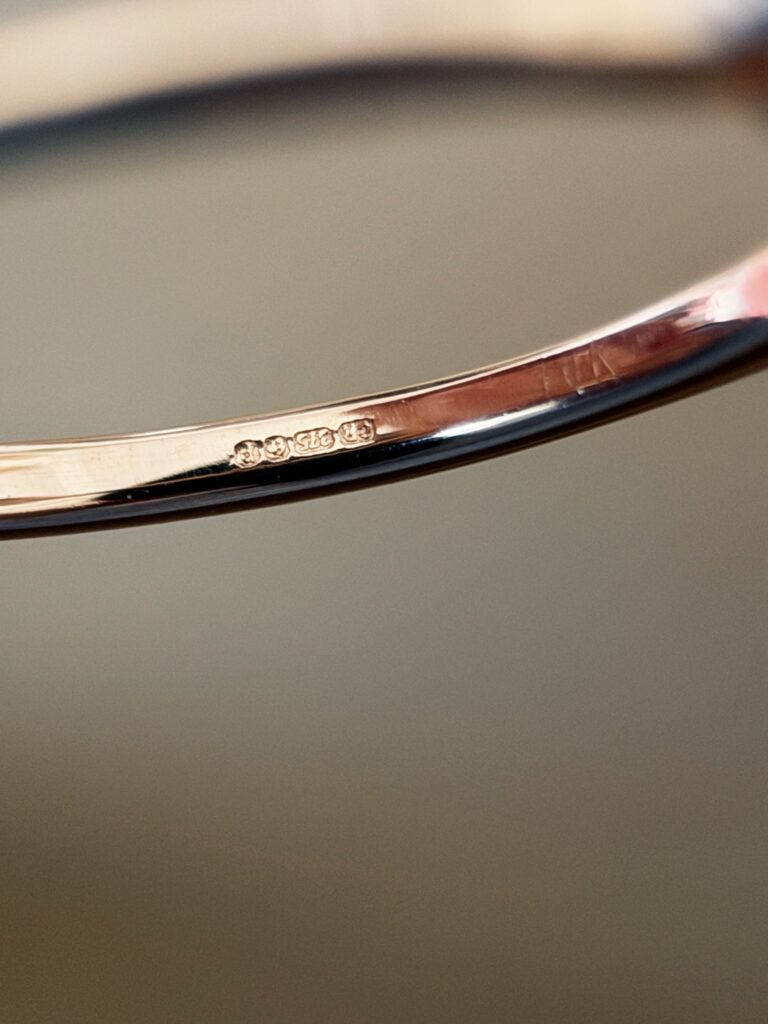Close-up of English hallmarks inside a vintage 10 carat gold ring
