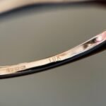 Close-up of English hallmarks inside a vintage 10 carat gold ring