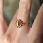Vintage 9 carat gold yellow citrine cluster ring worn on a hand