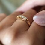 Antique 18 carat gold old european cut diamond fivestone ring worn on a hand