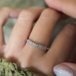 Vintage gold diamond row ring worn on hand