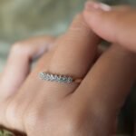 Vintage gold diamond row ring worn on hand