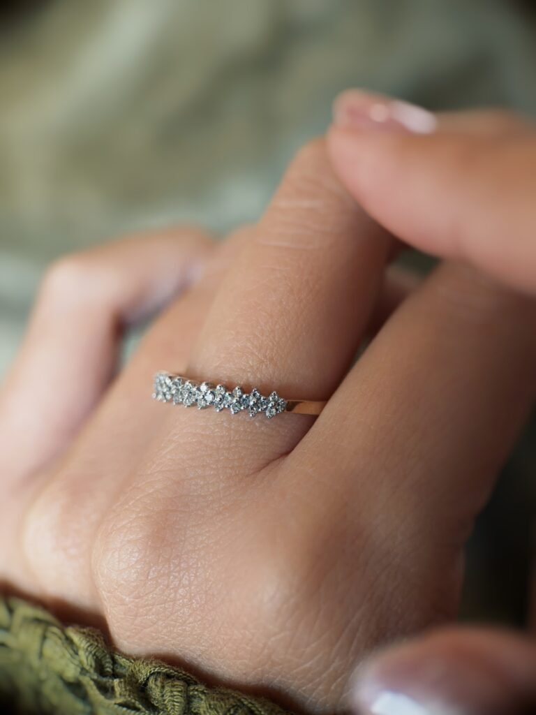 Vintage gold diamond row ring worn on hand