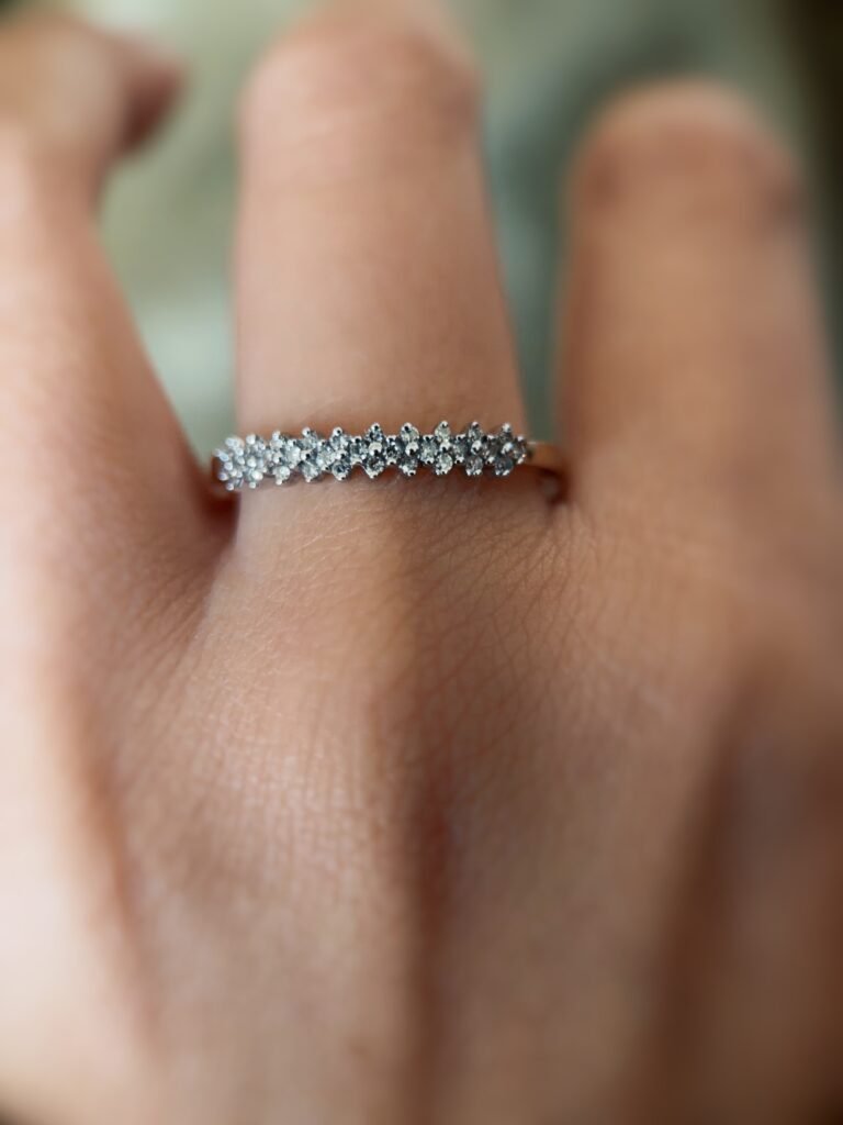 Vintage gold diamond row ring worn on hand
