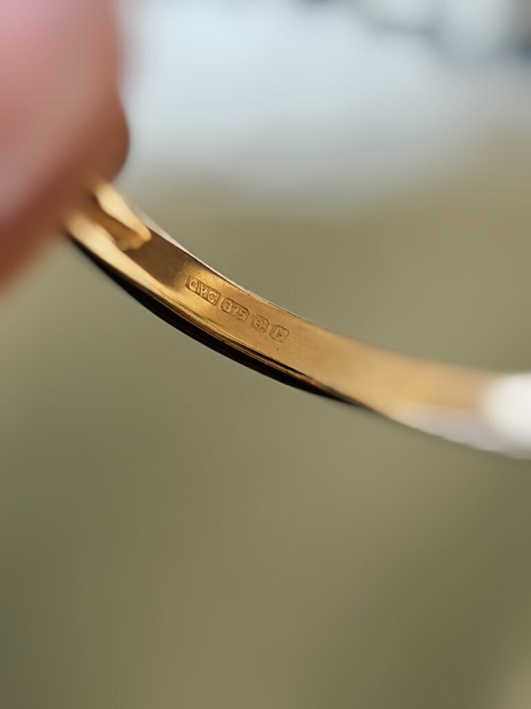 Close-up of English hallmarks inside a vintage 9 carat gold ring