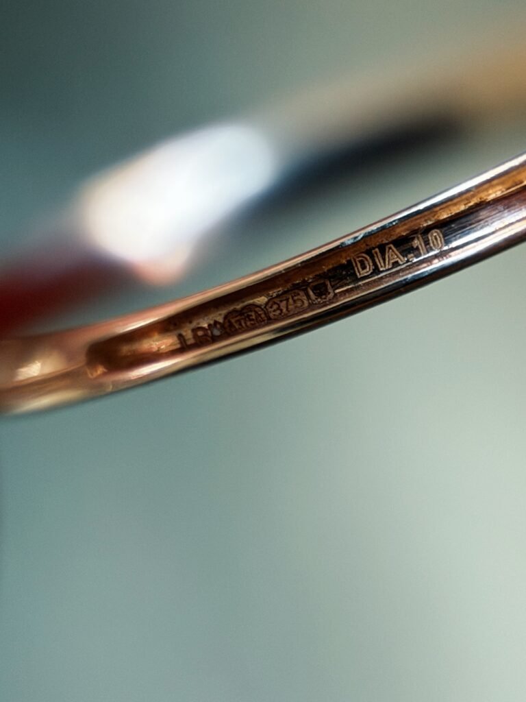 Close-up of English hallmarks inside a vintage 9 carat gold ring
