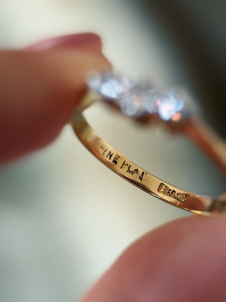 Close-up of English hallmarks inside a antique 18 carat gold ring
