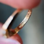 Close-up of English hallmarks inside a antique 18 carat gold ring