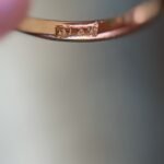 Close-up of English hallmarks inside a antique 18 carat gold ring