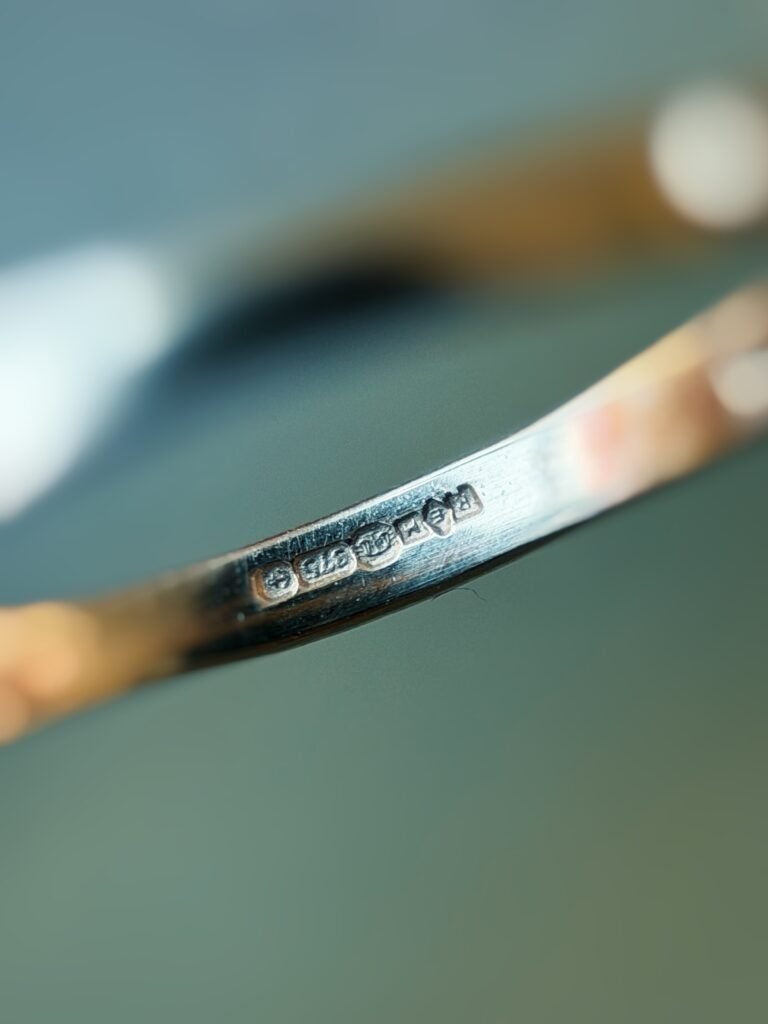 Close-up of English hallmarks inside a vintage 9 carat gold ring